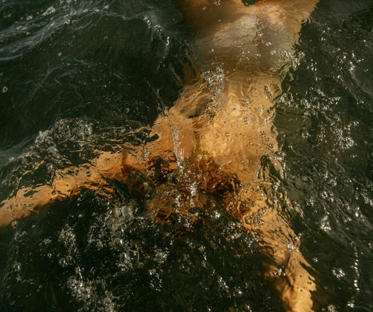 Woman swimming under water