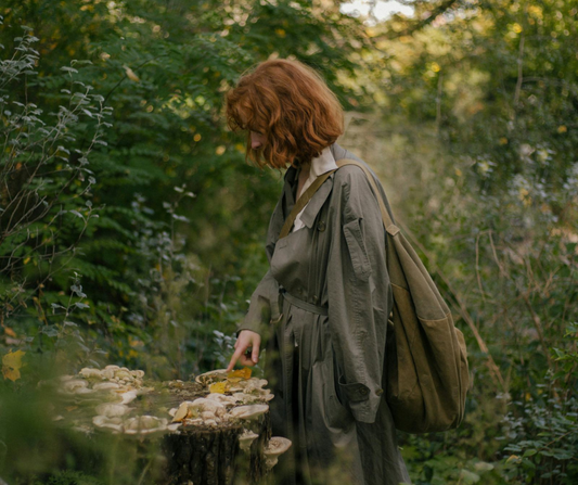 Woman in forest with bag