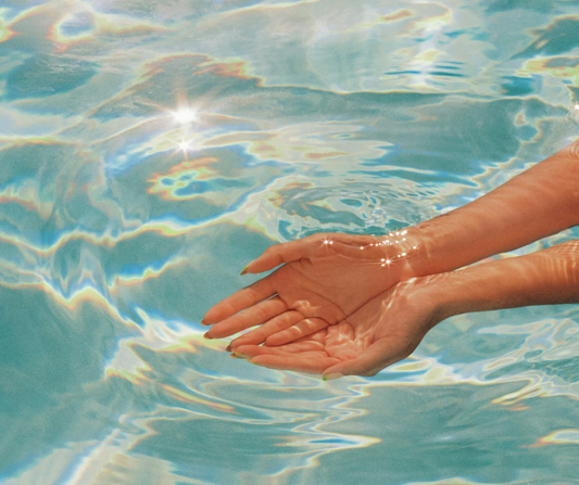 A pair of hands in water