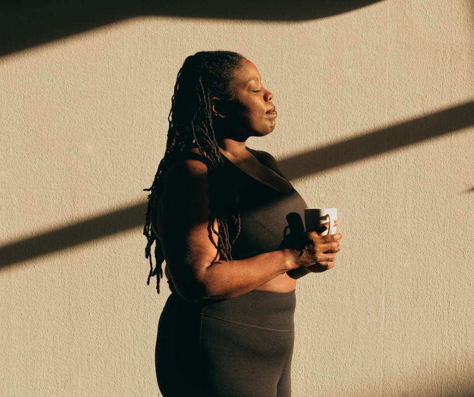Woman holding cup in her hand