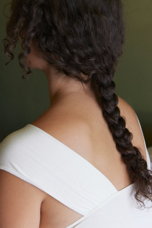 Woman facing away from the camera with braided hair