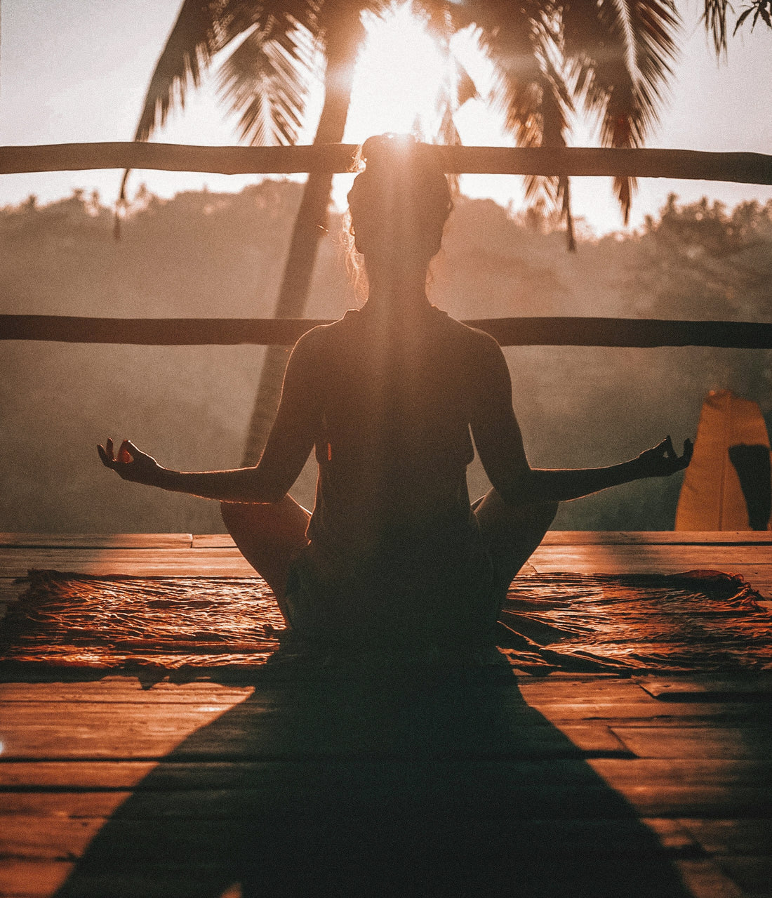 Woman doing yoga outdoors in the sun